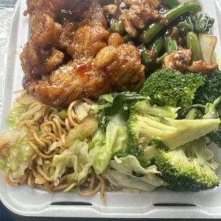 Plate with half chow mein and veggies, orange chicken &amp; string bean chicken