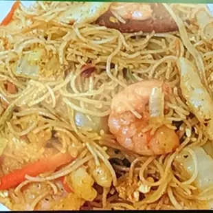 a plate of noodles and shrimp