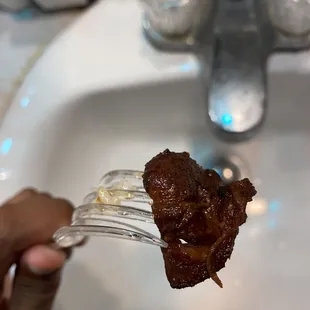 A odd piece of "chicken". Tell me, have you ever see. a chicken with a tail?