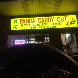 the front of a restaurant at night