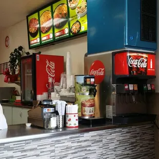 Cashier and soda machine.