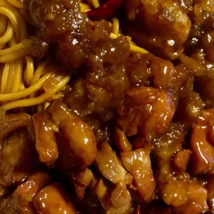 Orange chicken and honey-glazed chicken with chow mein moodles. Tasty.