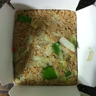 The vegetable fried rice was packed into my container like passengers on the subway in NYC during rush hour.