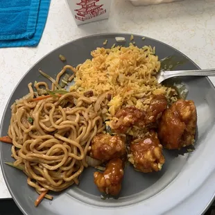 a plate of food with noodles and chicken