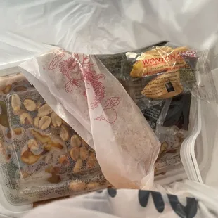 Inside the to go bag - Kung Pao chicken... they give you egg roll and fortune cookie and carry out soy sauce packet