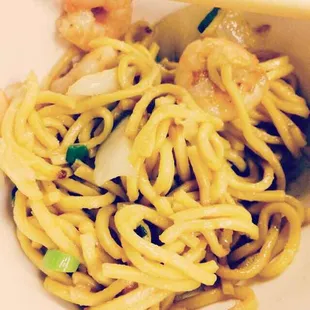 a plate of noodles and shrimp