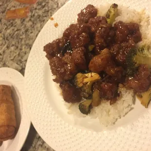 Orange chicken with white rice &amp; egg rolls on the side (to-go order plated at home).