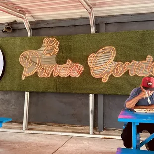a man sitting at a picnic table