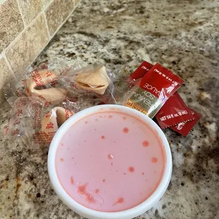Condiments, sweet and sour sauce and fortune cookies