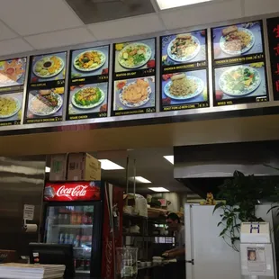 menus on the wall above the counter