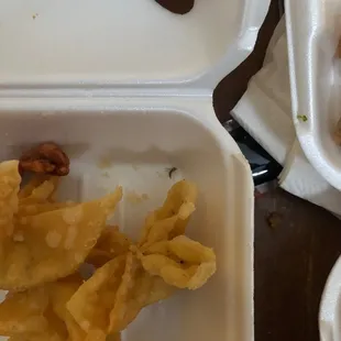 a close up of a meal in a styrofoam container