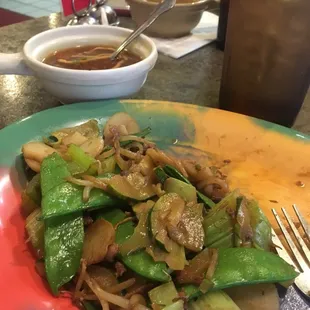 Pick your vegetables and meats and sauce and they stir fry it up!