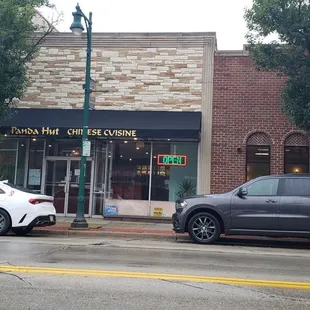 cars parked in front of the restaurant