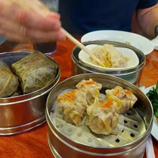 a man eating dumplings in a dim dim dim dim dim dim dim dim dim dim dim dim dim dim dim dim dim