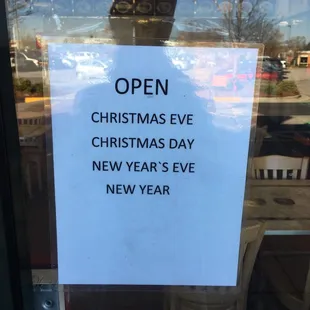 open christmas eve sign in window