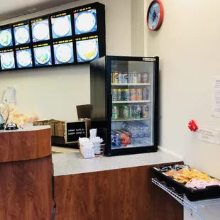 a restaurant counter with a variety of food items