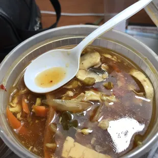 a bowl of soup with a spoon in it