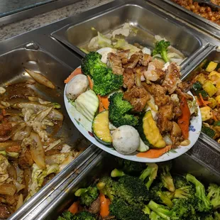a variety of food items in a buffet