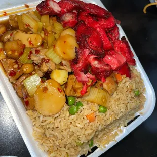 a take out container with rice and vegetables