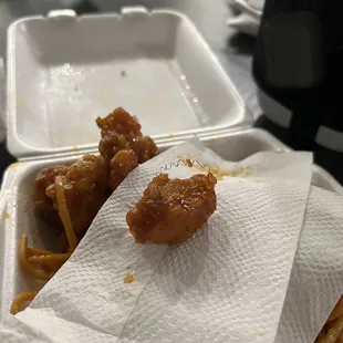 two pieces of food in a styrofoam container