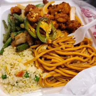 noodles and vegetables in a styrofoam container