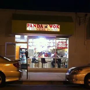two cars parked in front of a restaurant