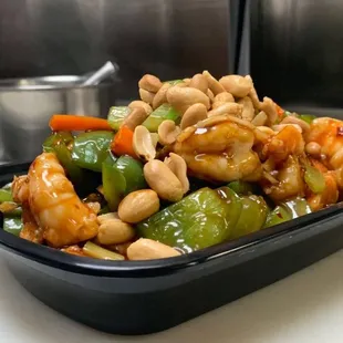 a bowl of stir fried vegetables and cashews