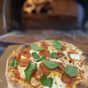 a pizza being cooked in an oven