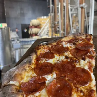 a slice of pepperoni pizza