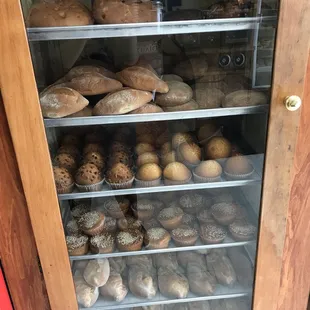  a display case full of baked goods