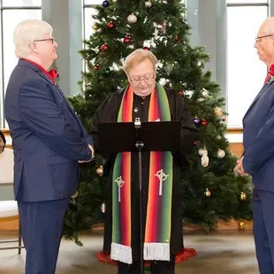 That is me doing my first same-sex marriage. My two best friends were getting married and as my gift to them was to preform their ceremony.