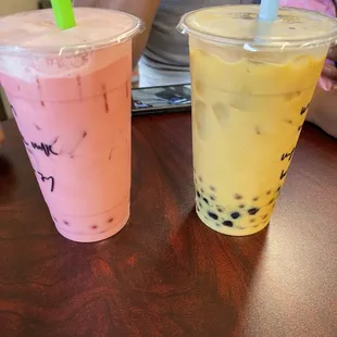 Pomegranate black milk tea with strawberry popping boba  Mango black milk tea with tapioca pearls and mango popping boba