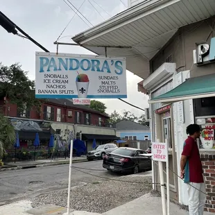a man standing in front of a store