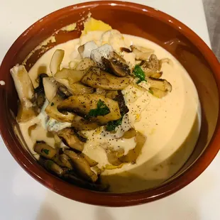 a bowl of pasta with mushrooms