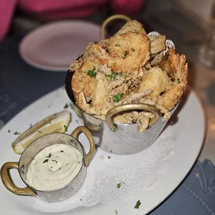 a plate of food with a bowl of dipping sauce