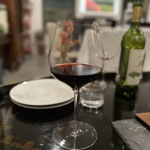 a glass of wine on a table
