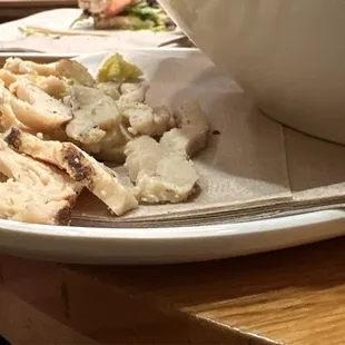 Half of the chicken we picked out of the Caesar salad