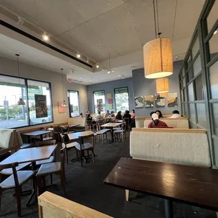 a dining area with tables and chairs