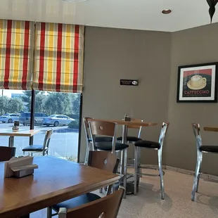 Dining area room with windows to parking lot.