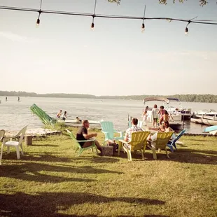 a group of people sitting on lawn chairs