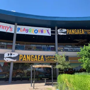 The entrance on the left of the sign on ground level; the restaurant is upstairs