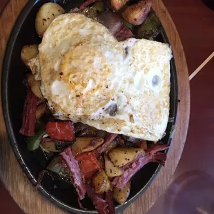 Corned beef with over medium eggs on top. Awesome 10/10.