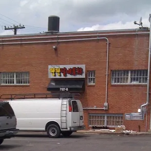 a van parked in front of a building