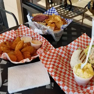 two baskets of food on a table