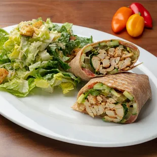 Chicken Wrap: ABF Chicken, Hummus, Romaine Lettuce, Tomato, Cucumber, Pickle, Mint, Basil. Wrapped in a Whole Wheat Tortilla.