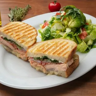 Salmon Brie Panini made to order with Atlantic salmon, brie cheese, Roma tomatoes, fresh dill, capers and red onions.