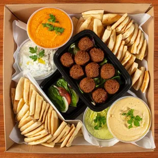 Appetizer Combination Catering Tray: Hummus Trio, Tzatziki, Falafels, Caprese, and Pita/Cucumbers