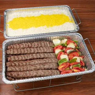 Beef Koobideh Kabob Catering Tray: 20 skewers of koobideh kabobs and grilled vegetables along with choice of side