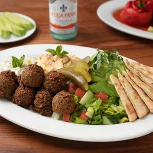 Falafel Platter: Made to order with vegan falafels, homemade spreads, pita, and choice of salad.