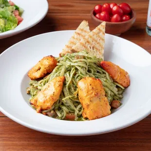 Chicken Pesto Linguine: Made to order with grilled chicken, homemade pesto, cream, tomatoes and garlic.